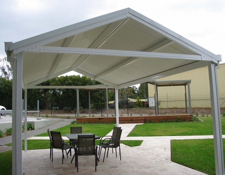 A white pitched roof Colorbeam pergola at the Spantec display suite