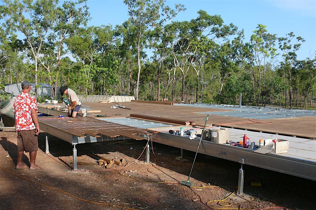 Boxspan floor frame on Ezipier with timber decking and floor sheet installation underway