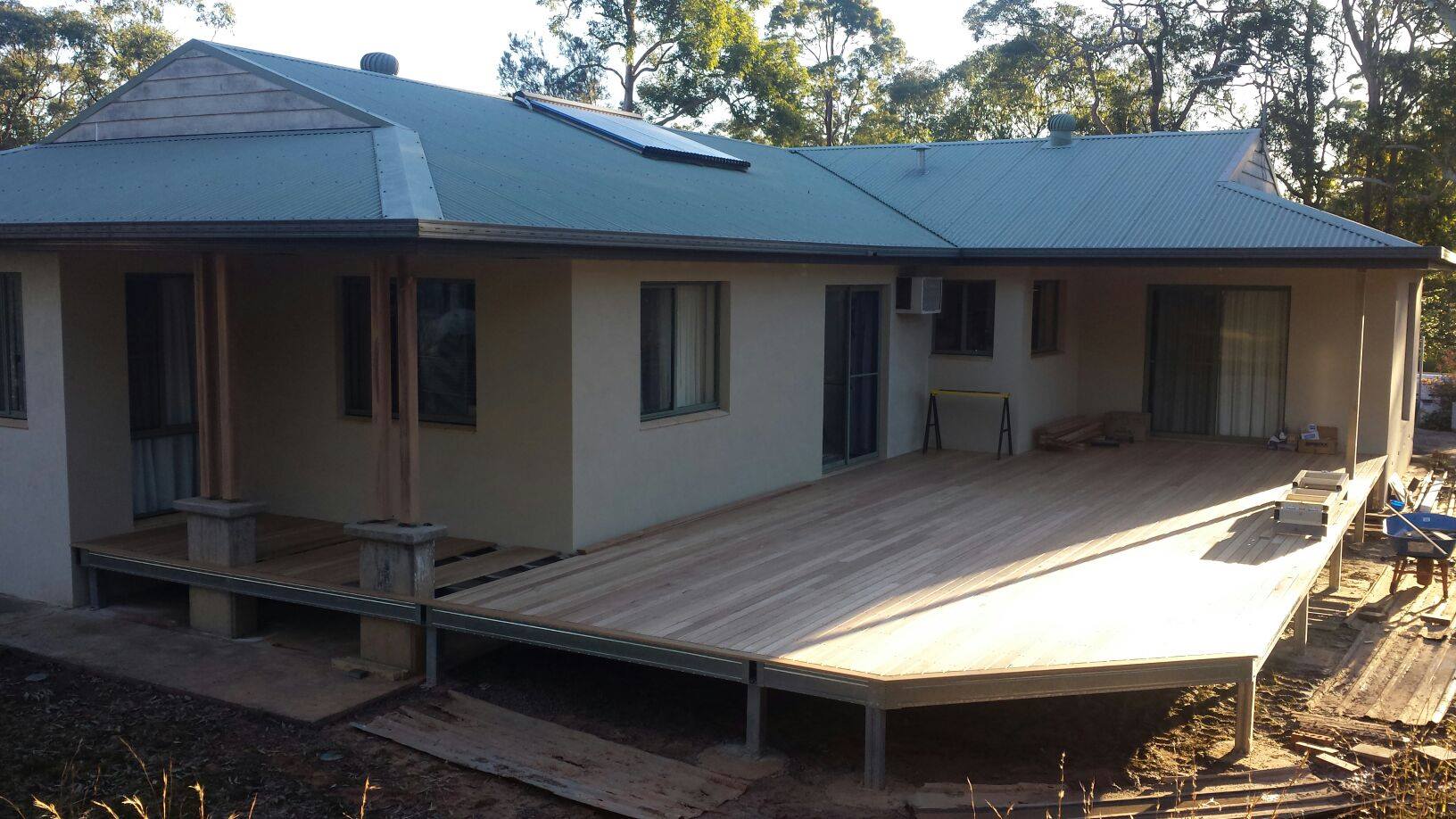 Decking boards down on Boxspan steel bearers and joists to increase outdoor living space for this existing house
