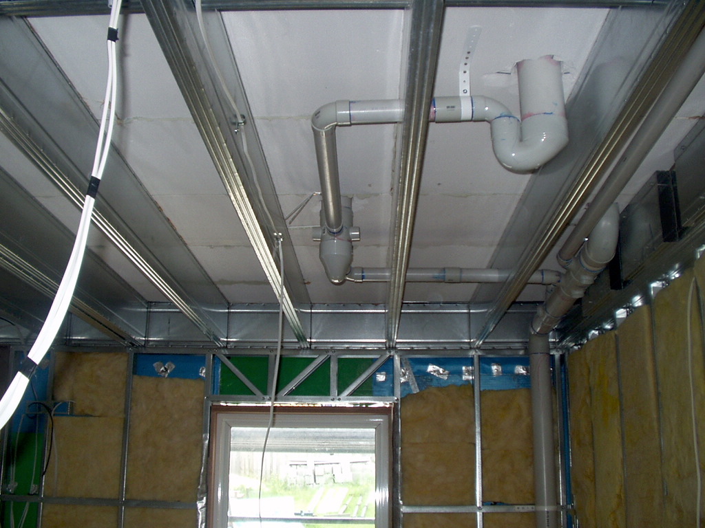 Boxspan upper floor frame beams with service holes for plumbing and electrical cables
